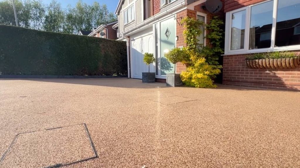 Driveways and Patios projects Clean driveway with decorative plants.